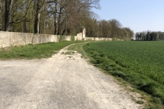 path out of town alongside a domaine fence